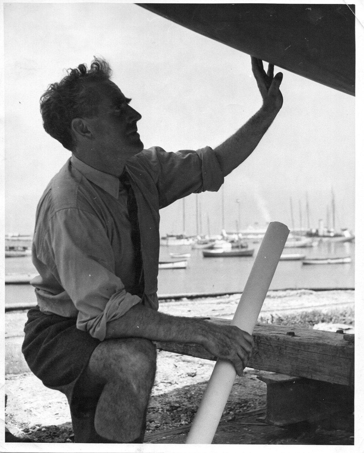 Uffa inspecting the hull of one of his designs